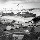 Illustration for article titled D-Day battle images merged with photos of tourists on the same spots